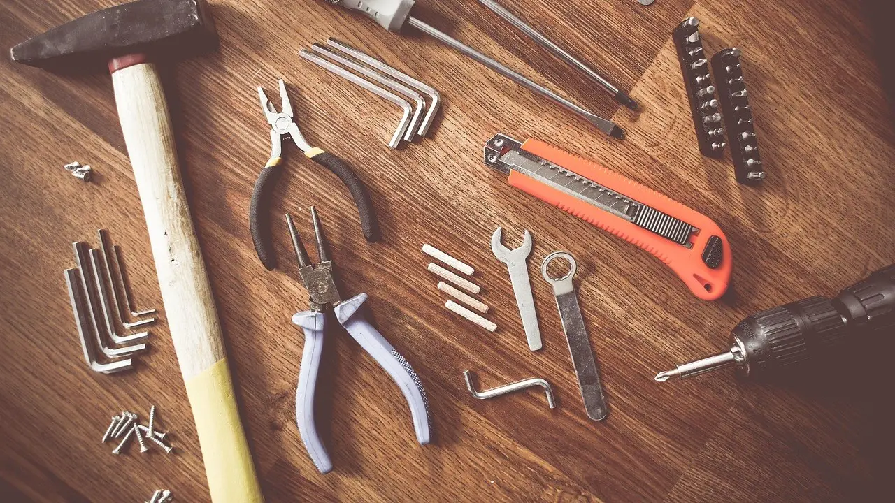Hand tools laid out on a wooden bench