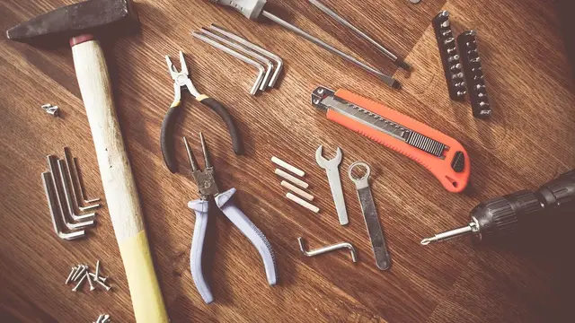 Hand tools laid out on a wooden bench