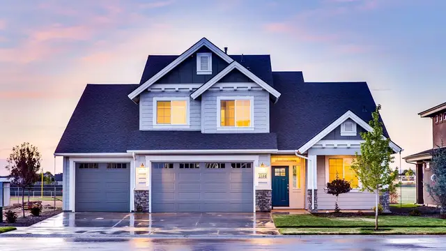 Suburban home with a new dark shingle roof